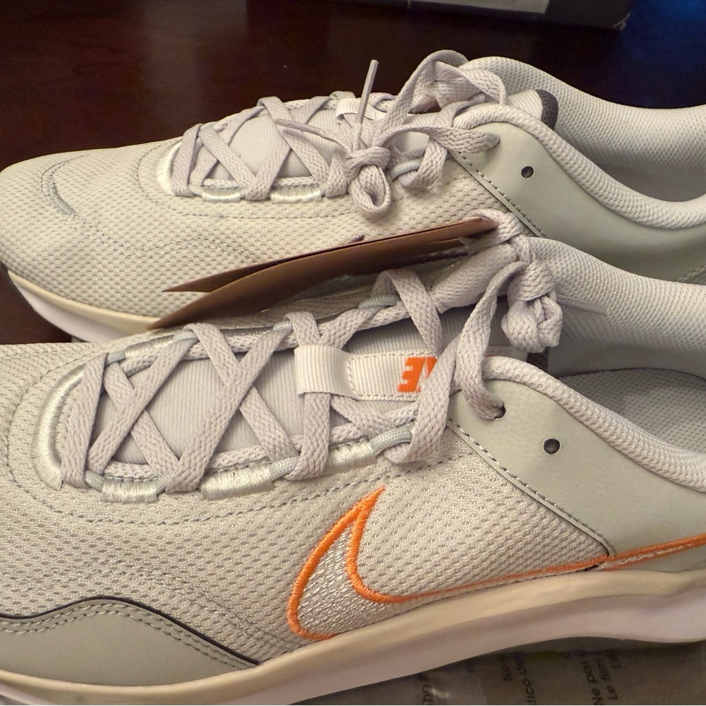 Nike Light Gray Sneakers with Orange Swoosh Accent